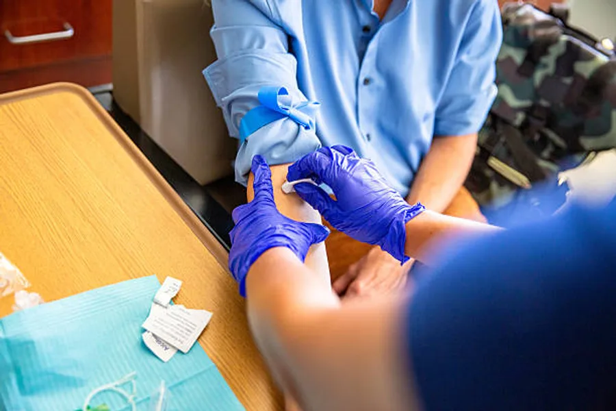 A DS2 phlebotomist collecting a specimen